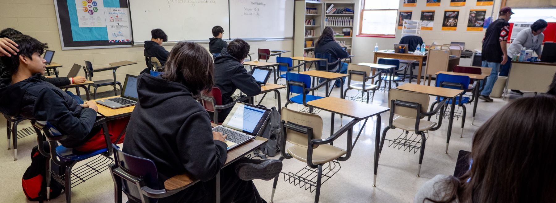 classroom full of students working at their desks